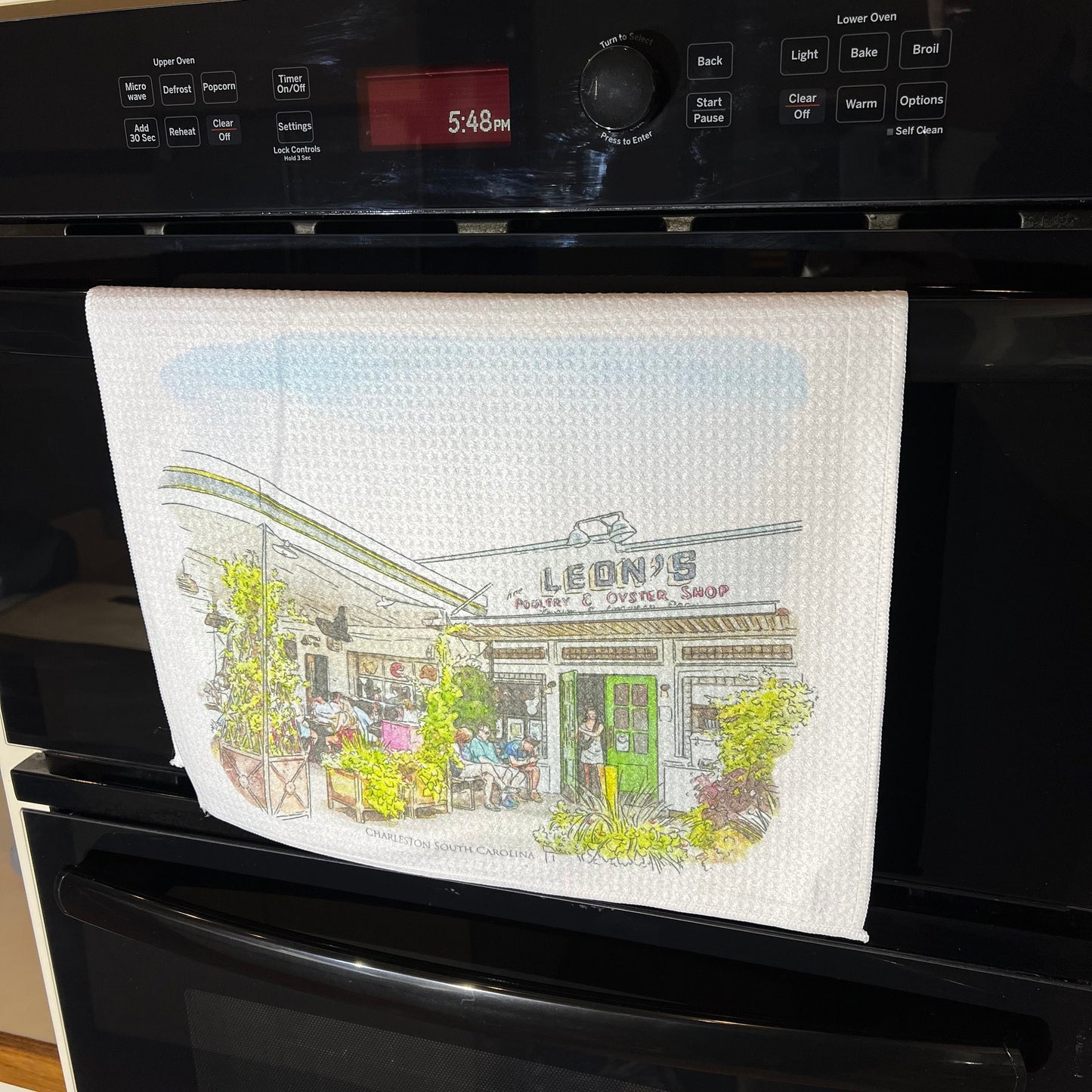 Leons Oyster Shop Charleston South Carolina (watercolor painting) printed on a microfiber kitchen towel 16" x 24"